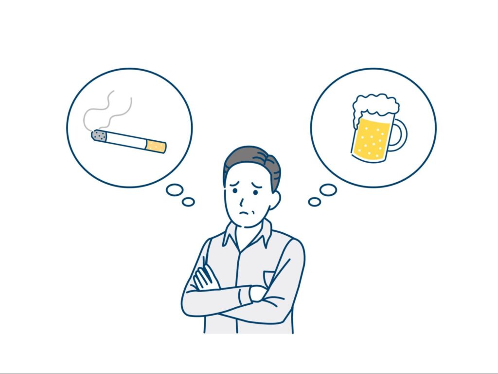 タバコとアルコールについて考えている男性